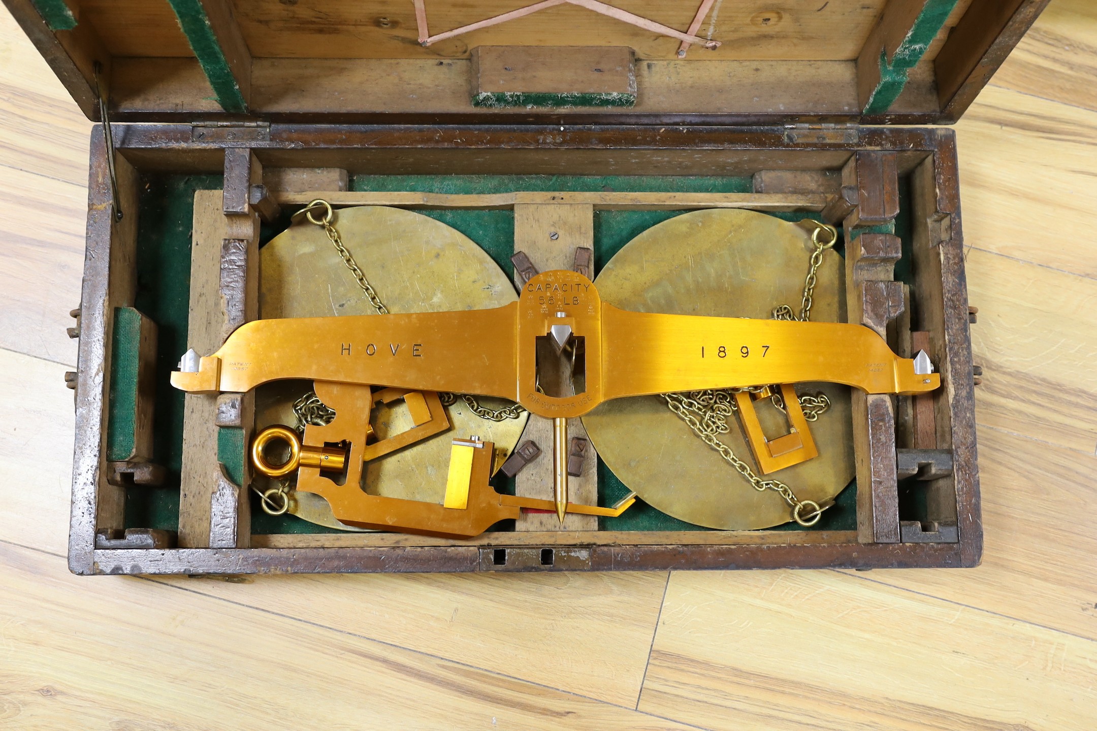 A De Grave & Co. hanging pan scale, Hove (council) 1897, 63cm wide, in original fitted pine case